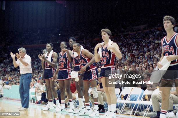 Summer Olympics: USA coach Bobby Knight, Sam Perkins, Wayman Tisdale, Patrick Ewing, Alvin Robertson, Chris Mullin and Steve Alford on sidelines...