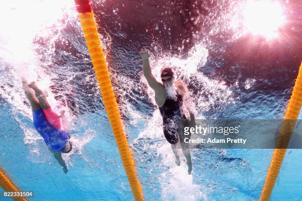 Katie Ledecky of the United States laps fellow competitor, Mireia Belmonte of Spain during the Women's 1500m Freestyle final on day twelve of the...