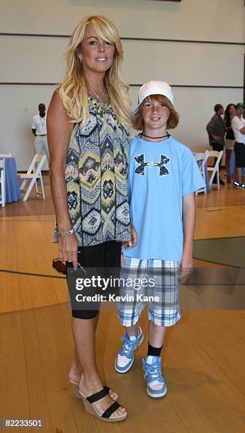 Dina Lohan with son Cody are seen prior to the Jonas Brothers Rocking Out at Ross School on August 9, 2008 in East Hampton, New York