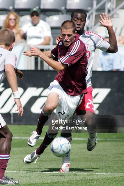 Colin Clark of the Colorado Rapids dribbles the ball against Nana Attakora-Gyan of Toronto FC during the MLS game on August 9, 2008 at Dicks Sporting...