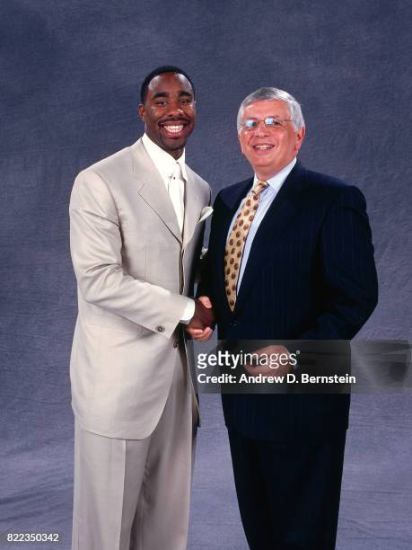 Mateen Cleaves shakes hands with NBA Commissioner David Stern after he was selected number fourteen overall by the Detroit Pistons during the 2000...