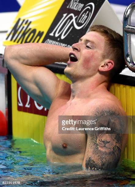 Adam Peaty of Great Britain celebrates victory in a world record time of 25.95 during the Men's 50m Breaststroke final two on day twelve of the...