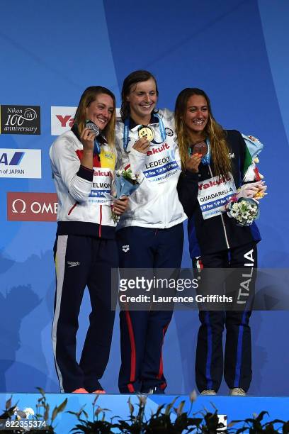 Silver medalist Mireia Belmonte of Spain, gold medalist Katie Ledecky of the United States and bronze medalist Simona Quadarella of Italy pose with...