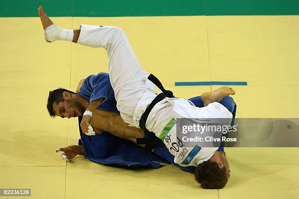 Tomasz Adamiec of Poland competes against Arash Miresmaeili of Iran in the judo event during day 2 of the Beijing 2008 Olympic Games at the...