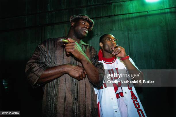 Shaquille O'Neal and Kobe Bryant of the Los Angeles Lakers smoke a celebratory cigar after winning Game Four of the 2002 NBA Finals against the New...