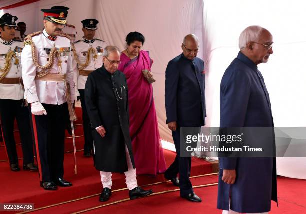 President Pranab Mukherjee, President-elect Ram Nath Kovind and Vice President Hamid Ansari in a ceremonial procession at Parliament House for the...