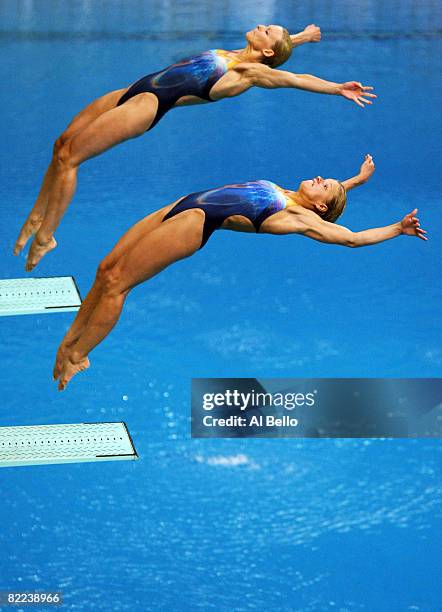 Ditte Kotzian of Germany and Heike Fischer of Germany competes in the Women's Synchronized 3m Springboard Final event held at the National Aquatics...