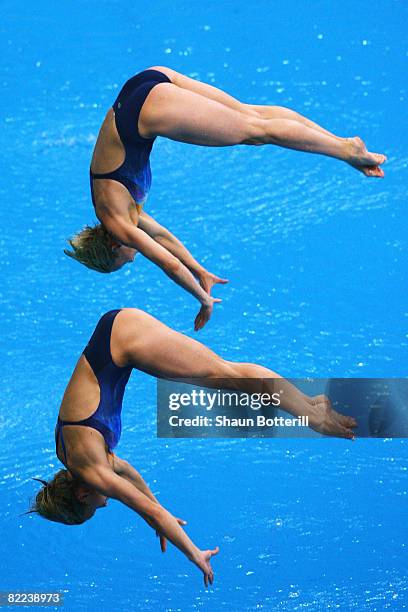 Ditte Kotzian of Germany and Heike Fischer of Germany competes in the Women's Synchronized 3m Springboard Final event held at the National Aquatics...