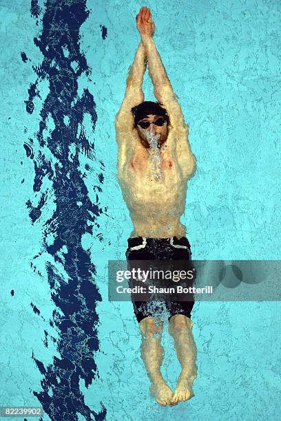 Helge Meeuw of Germany competes in the Men's 100m Backstroke Heat 5 event held at the National Aquatics Center during day 2 of the Beijing 2008...