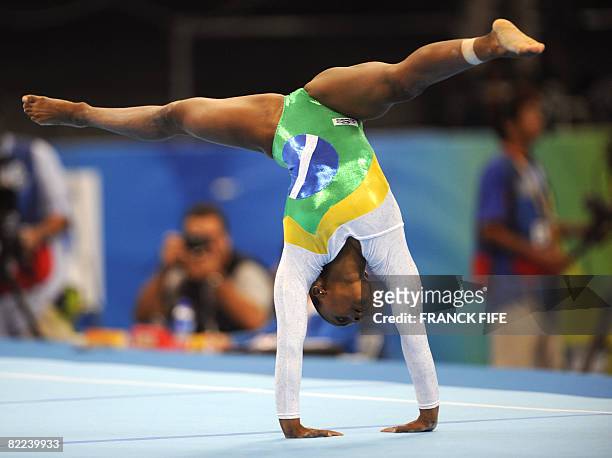 Brazil's Daiane Santos competes on on the floor during the women's qualification of the artistic gymnastics event of the Beijing 2008 Olympic Games...
