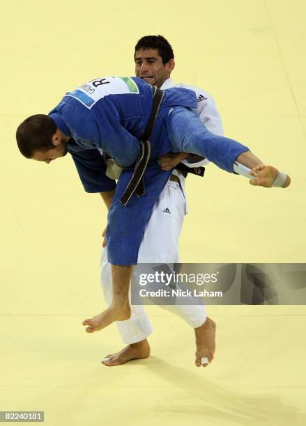 Yordanis Arencibia of Cuba lifts Alim Gadanov of Russia in the Men's -66 kg Judo event during day 2 of the Beijing 2008 Olympic Games at the...