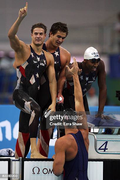 Ben Wildman-Tobriner, Nathan Adrian, Cullen Jones and Matt Grevers of the United States celebrate winning Men's 4 x 100m Freestyle Relay Heat 1 held...