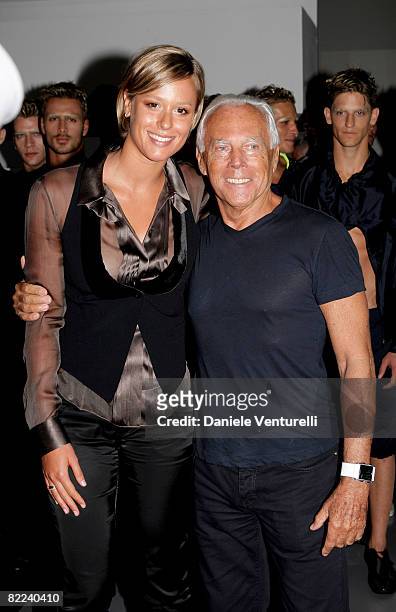 World Record swimmer Federica Pellegrini poses backstage with Giorgio Armani after the Emporio Armani fashion show as part of Milan Fashion Week...
