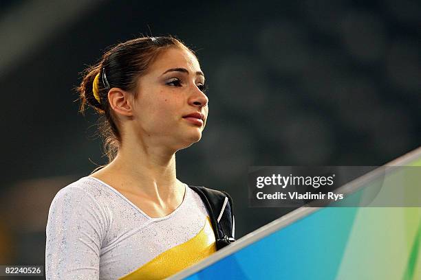 Lais Souza of Brazil walks off of the floor after competing the qualification round for the women's artistic gymnastics event held at the National...
