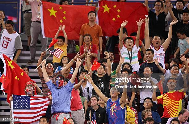 Fans in the stands cheer during the game between the United States and China during the day 2 preliminary game at the Beijing 2008 Olympic Games in...