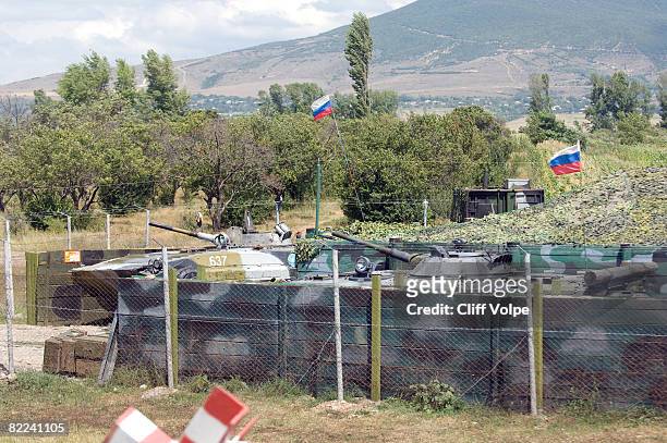 Military vehicles stand by at a Russian peacekeeping base, just outside of South Ossetia, on August 10, 2008 near Gori, Georgia. After calling a...