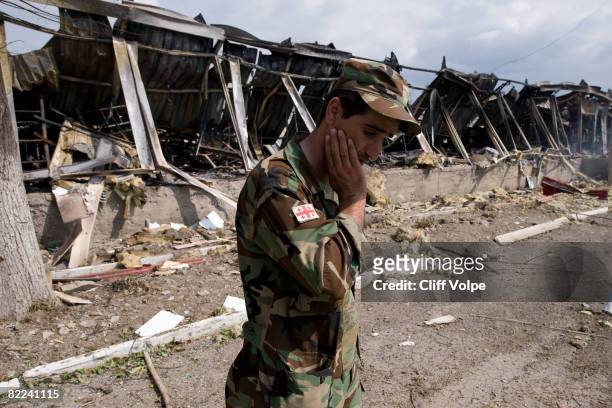 Georgian soldier mourns the loss of fellow troops, killed in a Russian airstrike in the area on August 9, 2008 in Gori, Georgia. After calling a...