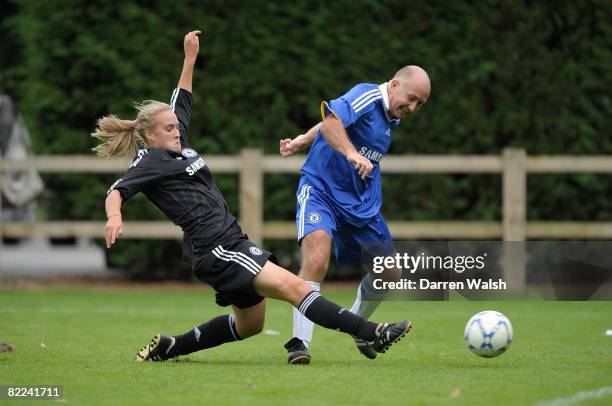 Chelsea ladies Shelby Hills and Chelsea Old Boys Clive Walker during Chelsea Ladies vs Chelsea Old Boys friendly match at Chelsea FC Training ground...