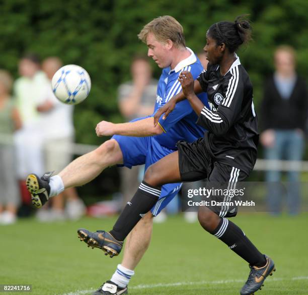 Chelsea ladies Anita Asante and Chelsea Old Boys Gareth Hall during Chelsea Ladies vs Chelsea Old Boys friendly match at Chelsea FC Training ground...