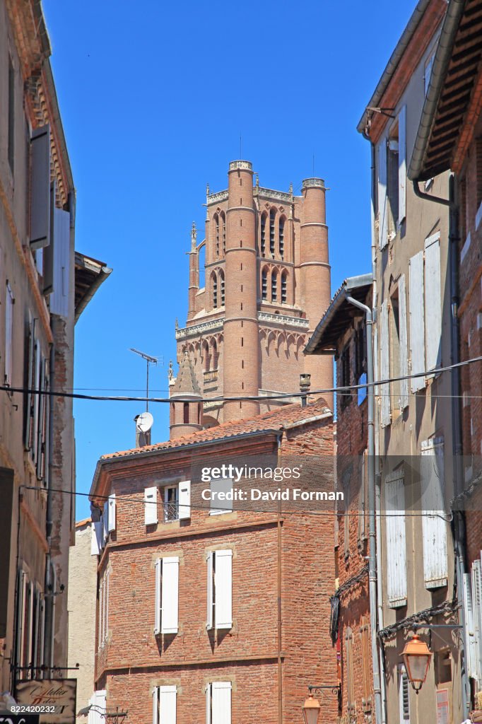 Cathedral bell-tower through Houses, Albi.