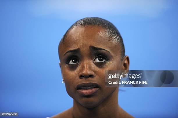 Brazil's Daiane Santos looks on during the women's qualification of the artistic gymnastics event of the Beijing 2008 Olympic Games in Beijing on...
