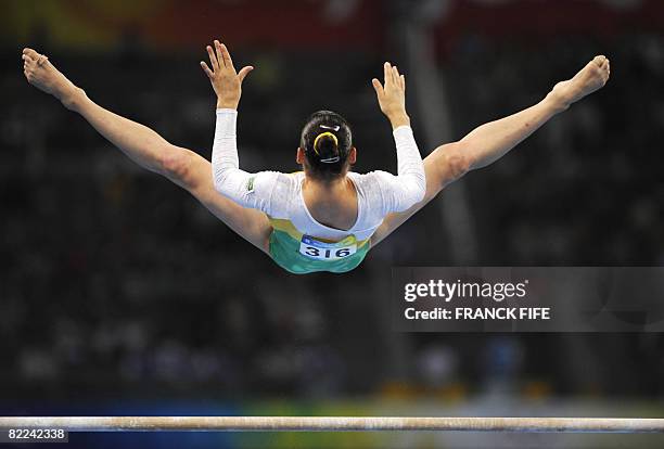 Brazil's Lais Souza competes on the uneven bars during the women's qualification of the artistic gymnastics event of the Beijing 2008 Olympic Games...