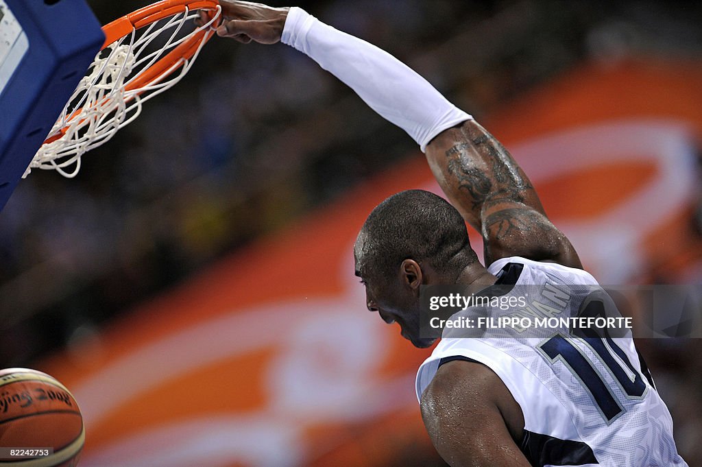 Kobe Bryant of the US dunks the ball aga