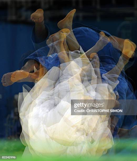 This multi-exposure image shows Iran's Arash Miresmaeili and Japan's Masato Uchishiba competing during their men's -66kg match of the 2008 Beijing...