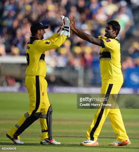 Thisara Perera and Phil Mustard of Gloucestershire celebrates the wicket of Colin Ingram of Glamorgan during the NatWest T20 Blast match between...