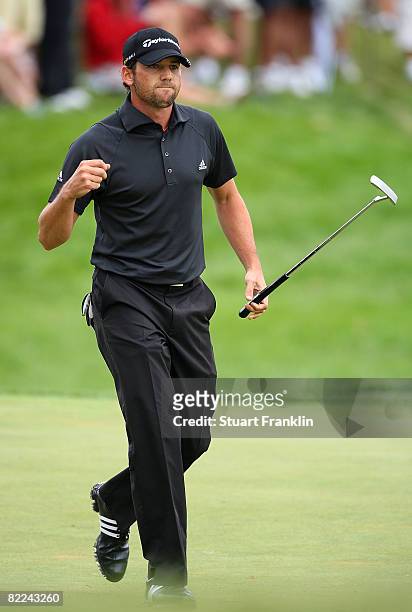 Sergio Garcia of Spain gives a fist pump for his par putt on the ninth hole during the final round of the 90th PGA Championship at Oakland Hills...