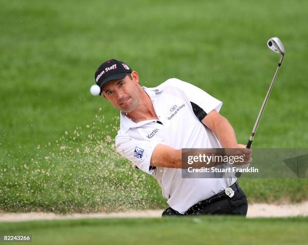 Padraig Harrington of Ireland plays third shot from a bunker on the ninth hole during the final round of the 90th PGA Championship at Oakland Hills...