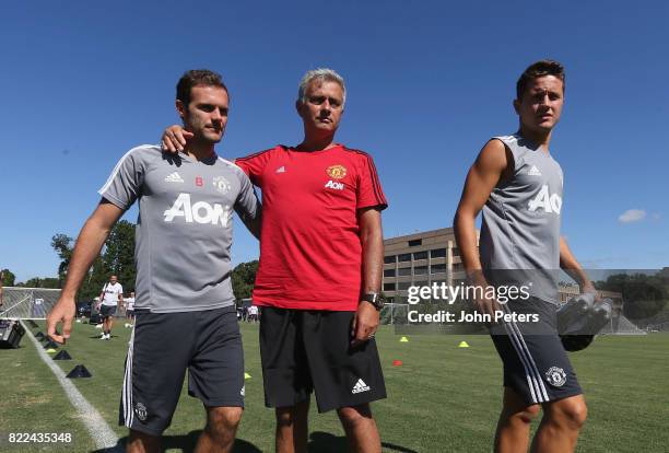 Manager Jose Mourinho, Juan Mata and Ander Herrera of Manchester United in action during a first team training session as part of their pre-season...