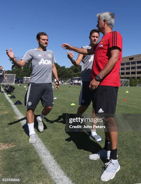 Manager Jose Mourinho, Juan Mata and Ander Herrera of Manchester United in action during a first team training session as part of their pre-season...