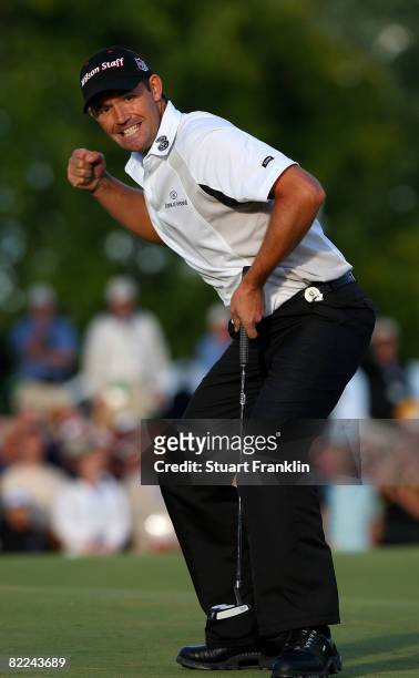 Padraig Harrington of Ireland celebrates with a fist pump after making par on the 18th hole during the final round of the 90th PGA Championship at...