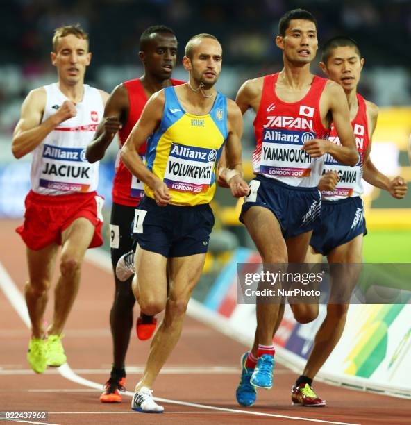 Pavio Voluikevych of Ukraine and Yusuke Yamanouchi of Japen compete of Men's 1500m T20 Final during World Para Athletics Championships Day Three at...