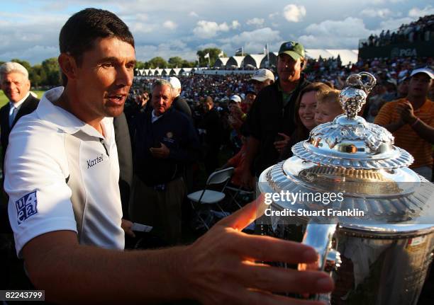 Padraig Harrington of Ireland approaches the PGA Championship Trophy as he walks up the players runway after exiting the 18th green having finished...