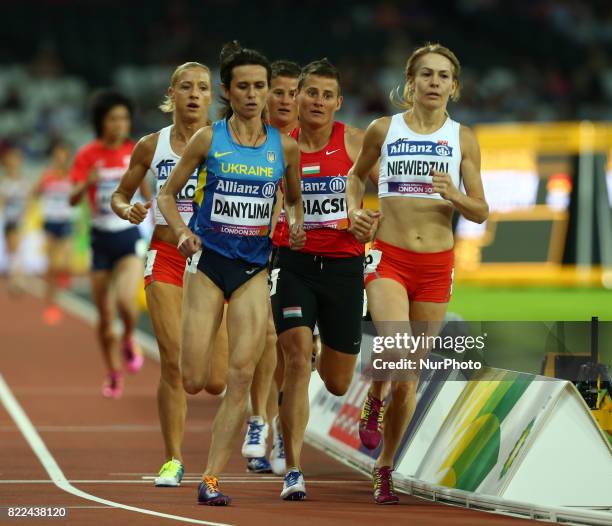 Liudmyia Danylina of Ukraine, Sayaka Makita of Japen and Barbara Niewiedzial of Poland compete Women's 1500m T20 Final during World Para Athletics...