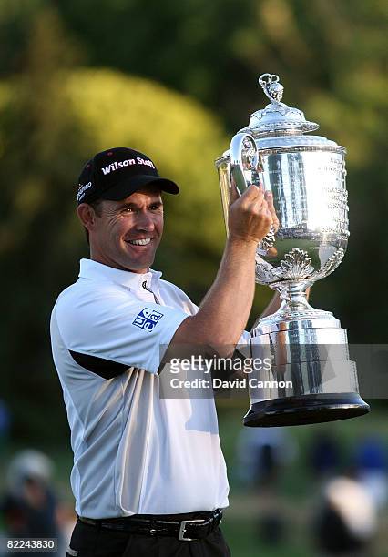 Padraig Harrington of Ireland celebrates with the PGA Championship Trophy after winning the final round of the 90th PGA Championship at Oakland Hills...