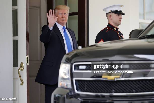 President Donald Trump waves to journalists while waiting to greet Lebanese Prime Minister Saad Hariri to the White House July 25, 2017 in...