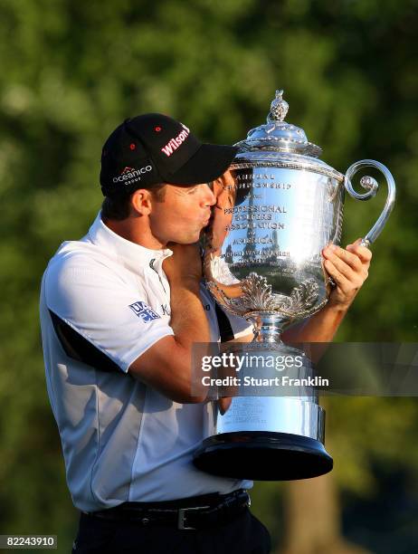 Padraig Harrington of Ireland celebrates with the PGA Championship Trophy after winning the 90th PGA Championship at Oakland Hills Country Club on...