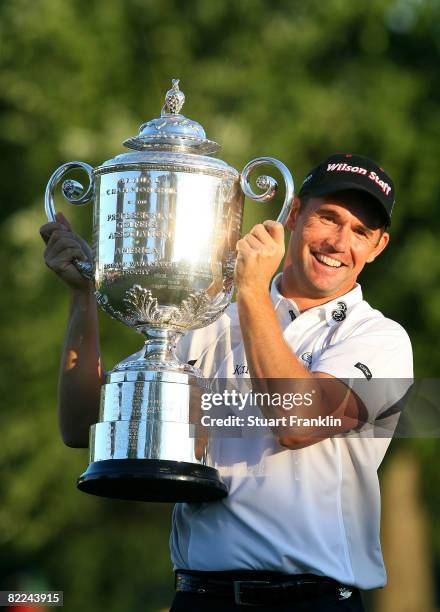 Padraig Harrington of Ireland celebrates with the PGA Championship Trophy after winning the 90th PGA Championship at Oakland Hills Country Club on...