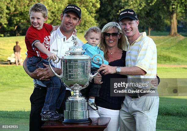 Padraig Harrington of Ireland celebrates with his wife Caroline Harrington , his two children, his caddie Ronan Flood and the PGA Championship Trophy...