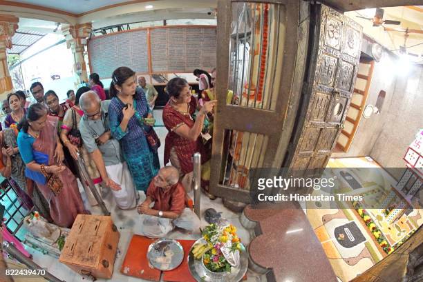 Year old Shiva temple decorated the Sanctum Sanctorum of lord with ghee and grains as devotees offer prayers on the first Shravan Somwar at Shiva...