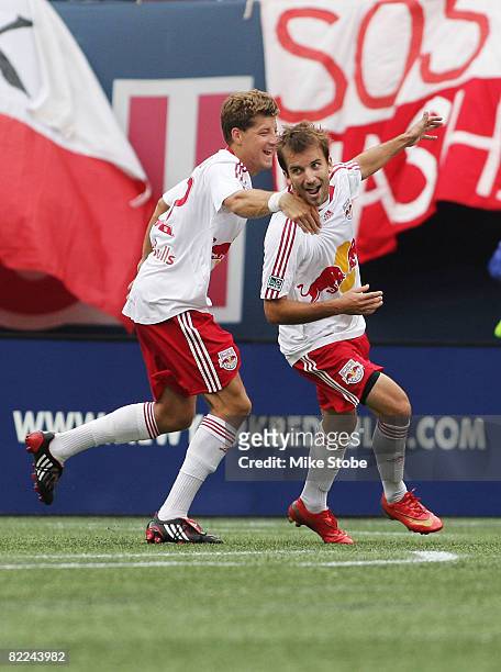 Mike Magee of the New York Red Bulls celebrates his goal in the 45th minute with teammate Luke Sassano at Giants Stadium in the Meadowlands on August...