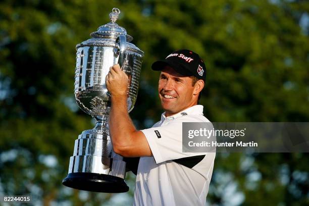 Padraig Harrington of Ireland celebrates with the PGA Championship Trophy after winning the 90th PGA Championship at Oakland Hills Country Club on...