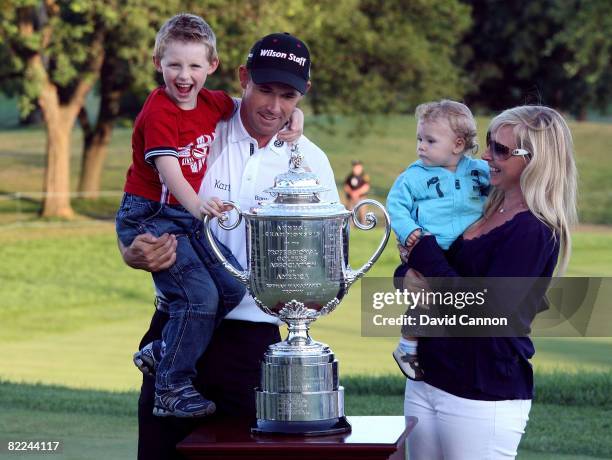 Padraig Harrington of Ireland celebrates with his wife Caroline Harrington , his two children and the PGA Championship Trophy after winning the 90th...