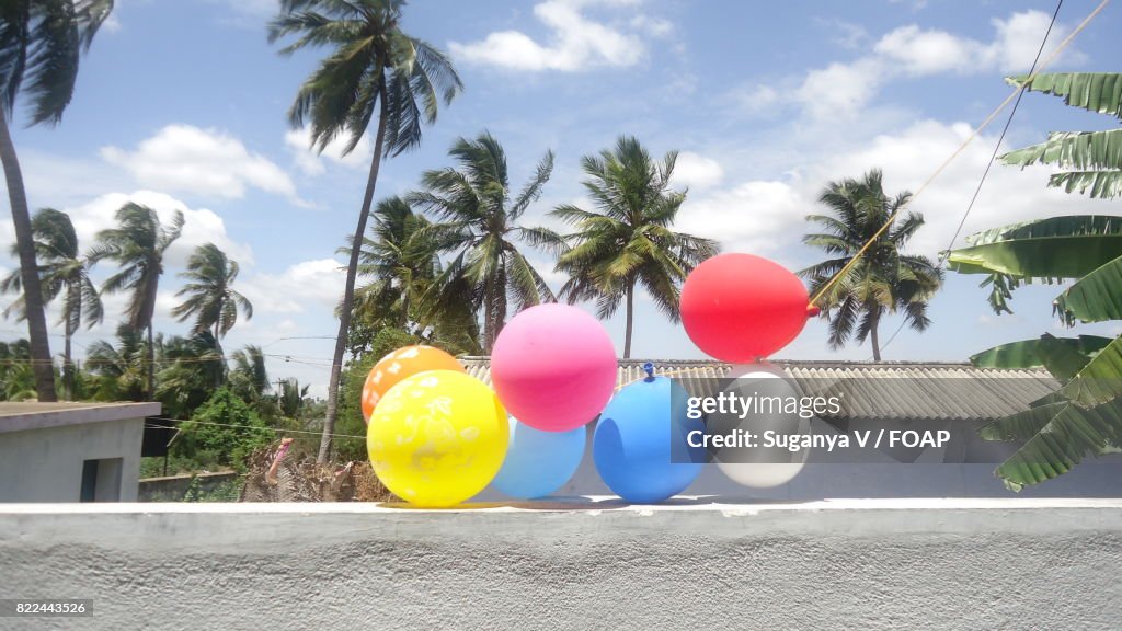 Balloons hanging on balcony