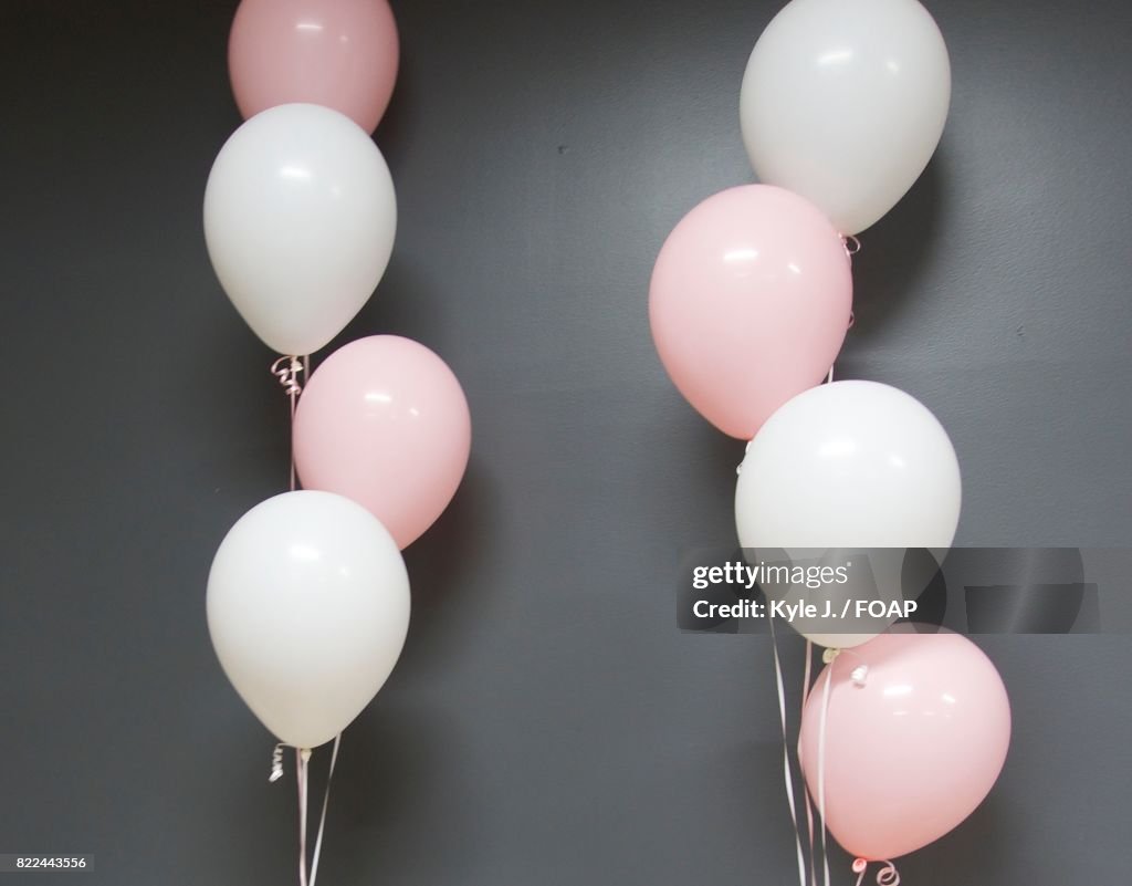 Close-up of pink and white balloons