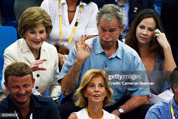 United States President George W. Bush, First Lady Laura Bush and daughter Barbara Bush attend the National Aquatics Center on Day 3 of the Beijing...