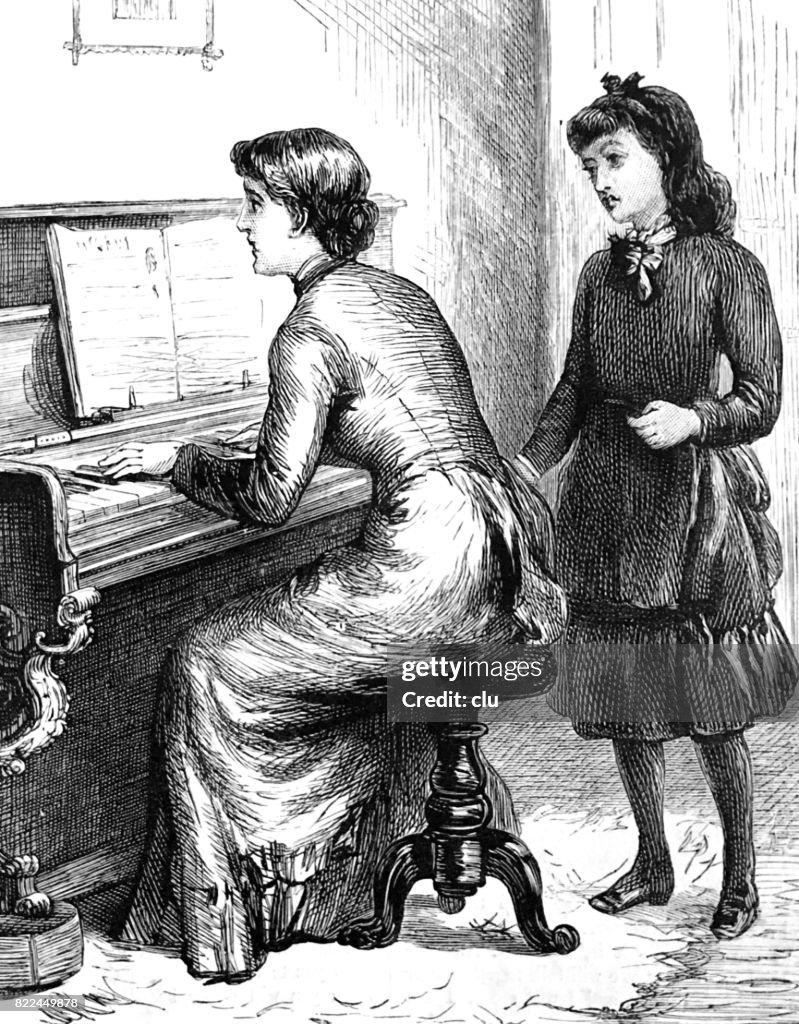 Woman playing piano, girl behind her listening